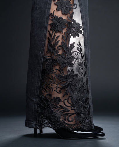 Close-up of the raised floral embroidery and scalloped lace hem